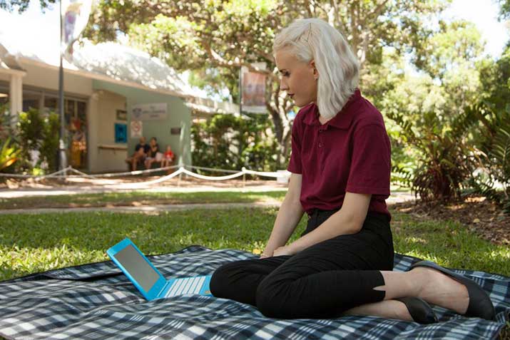 arts professional writing and publishing student josephine gunter studying outdoors